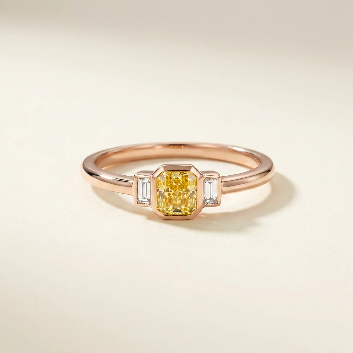 A .25ct yellow rectangular radiant diamond on a rose gold ring, custom-designed by Eterneva to honor the remarkable Daisy.