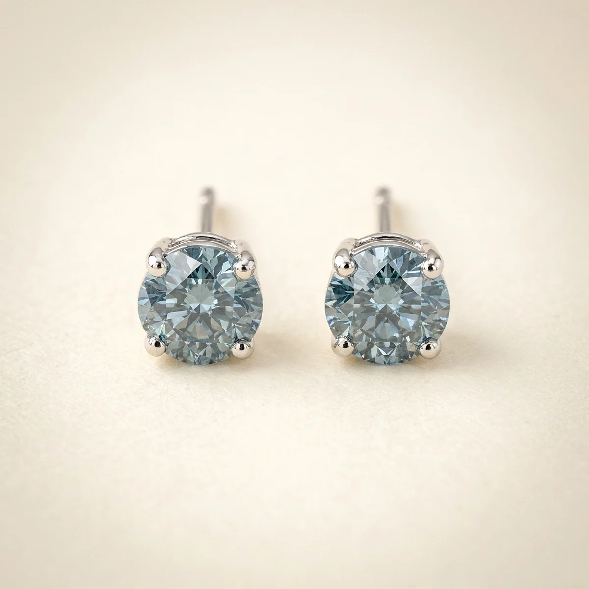 A .25ct blue round diamond on platinum earrings, custom-designed by Eterneva to honor the remarkable Joyce.