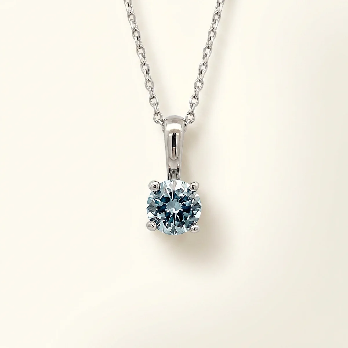 A .4ct blue round diamond on a white gold pendant, custom-designed by Eterneva to honor the remarkable Heath.
