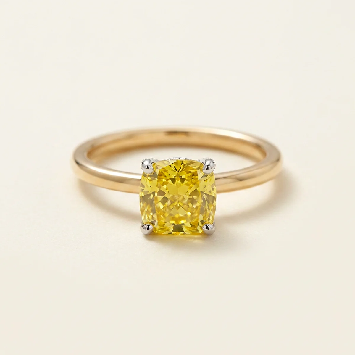 A 1.5ct yellow cushion diamond on a mixed metal ring, custom-designed by Eterneva to honor the remarkable Jacqueline.
