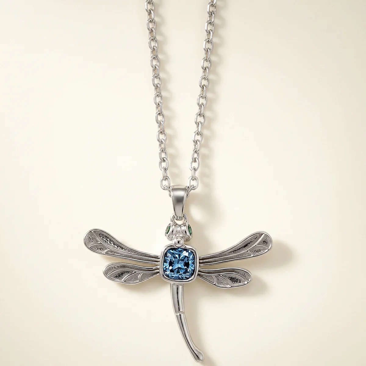 A .4ct blue cushion diamond on a white gold necklace, custom-designed by Eterneva to honor the remarkable junior.