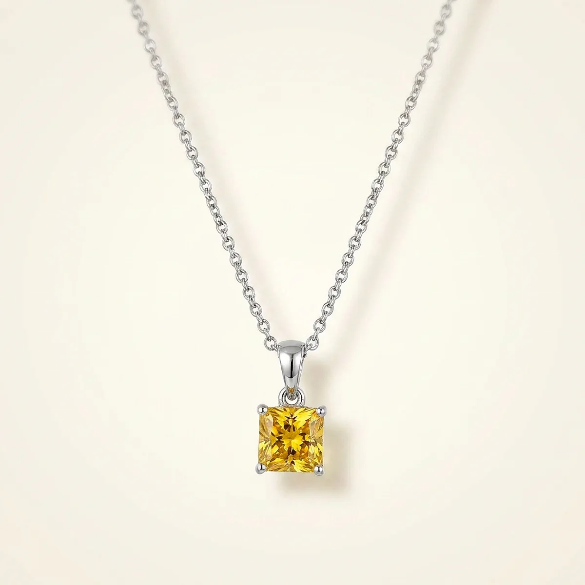 A .5ct yellow square radiant diamond on a platinum necklace, custom-designed by Eterneva to honor the remarkable Mitch.
