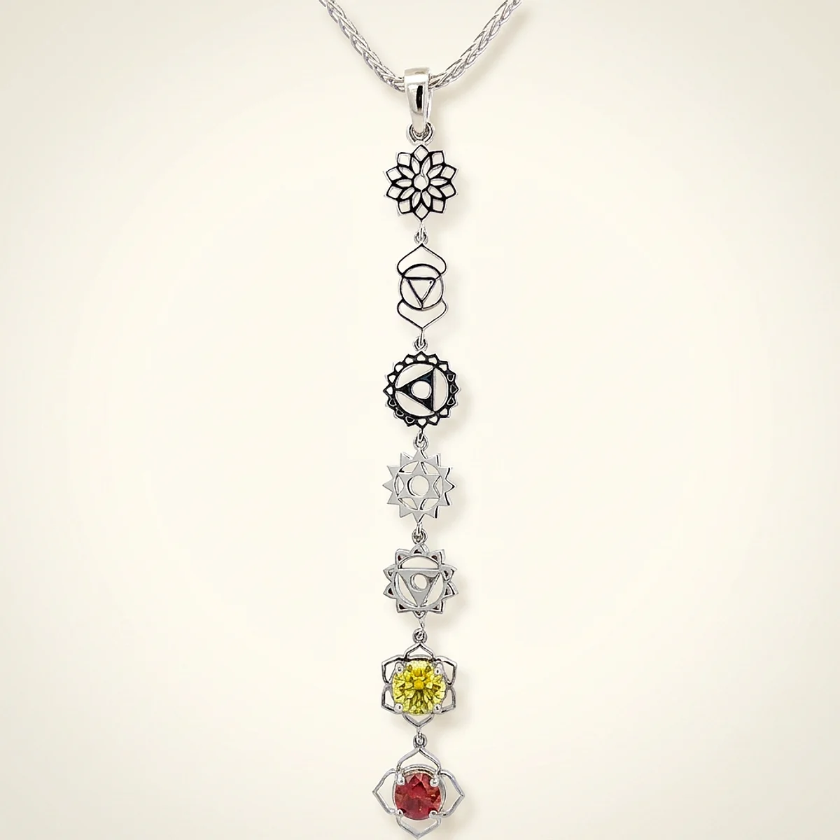 A .25ct red round diamond on a platinum pendant, custom-designed by Eterneva to honor the remarkable Loki.
