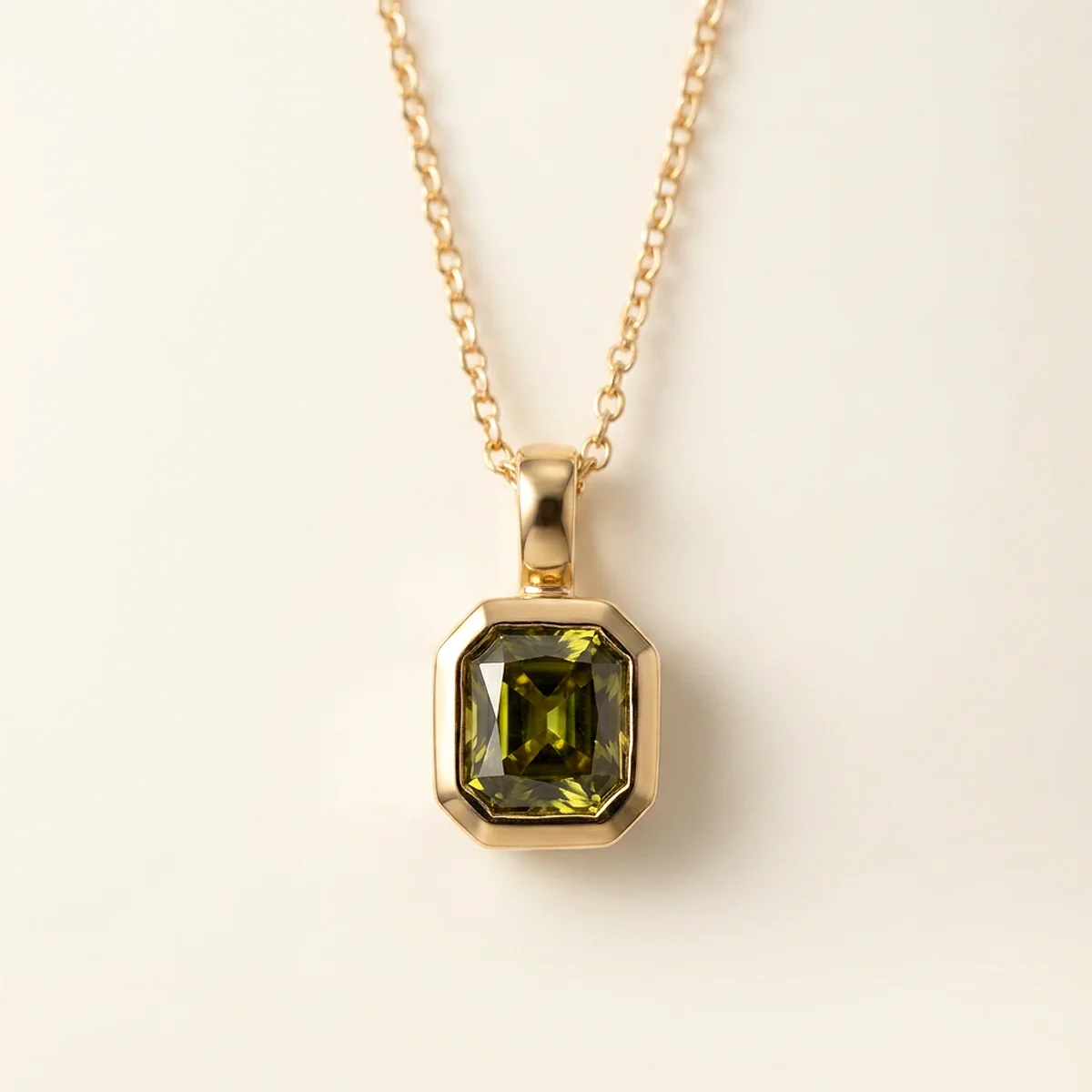 A .5ct green rectangular radiant diamond on a yellow gold pendant, custom-designed by Eterneva to honor the remarkable Warren.