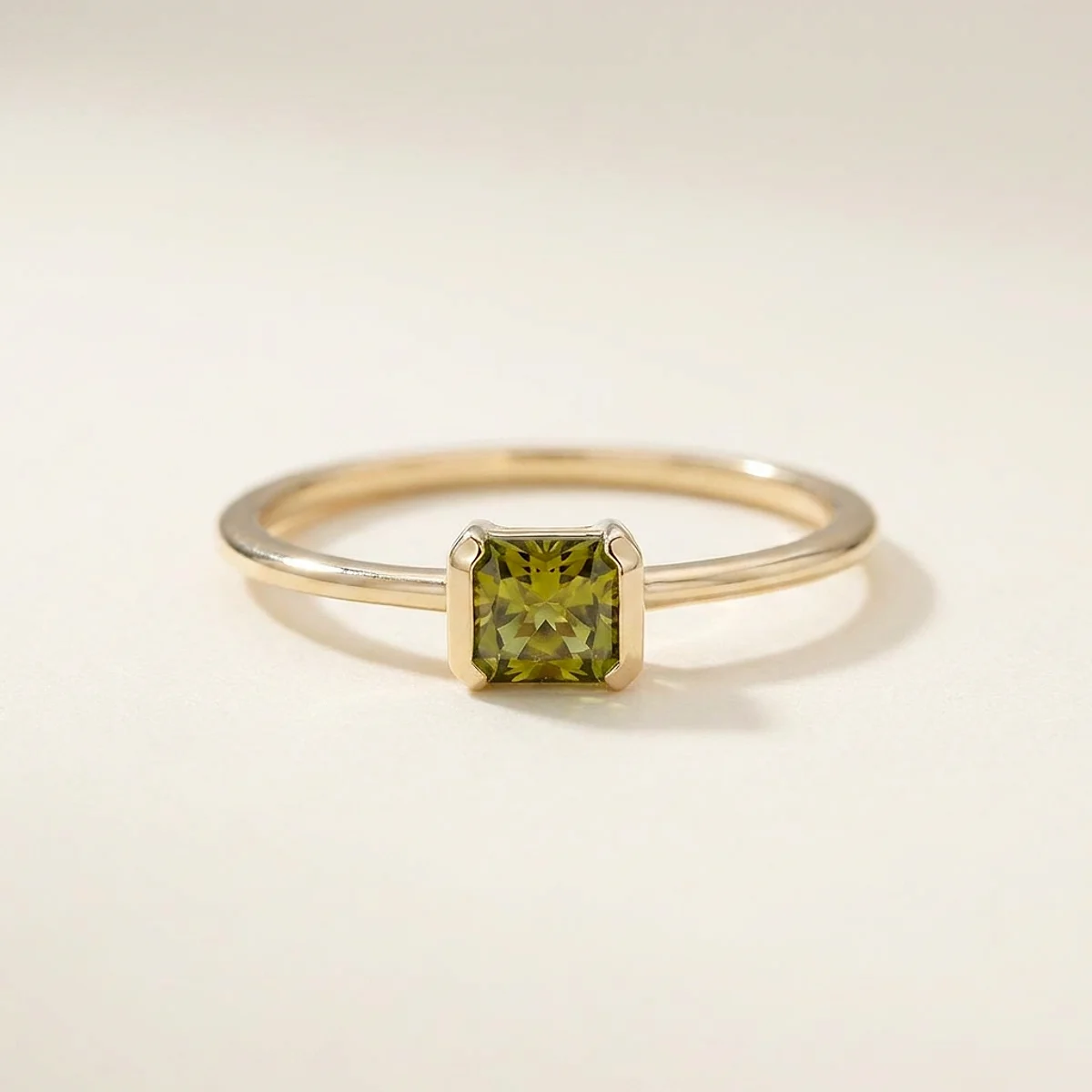 A .25ct green rectangular radiant diamond on a yellow gold ring, custom-designed by Eterneva to honor the remarkable Patricia.