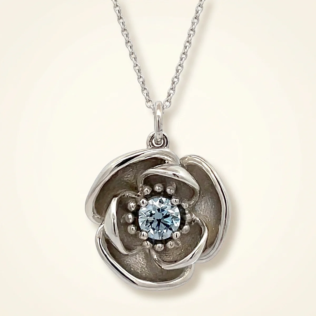 A .4ct blue round diamond on a platinum pendant, custom-designed by Eterneva to honor the remarkable John.