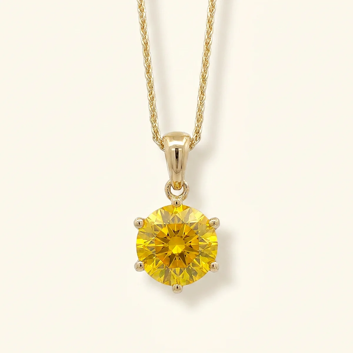 A 1ct yellow round diamond on a yellow gold necklace, custom-designed by Eterneva to honor the remarkable Toby.