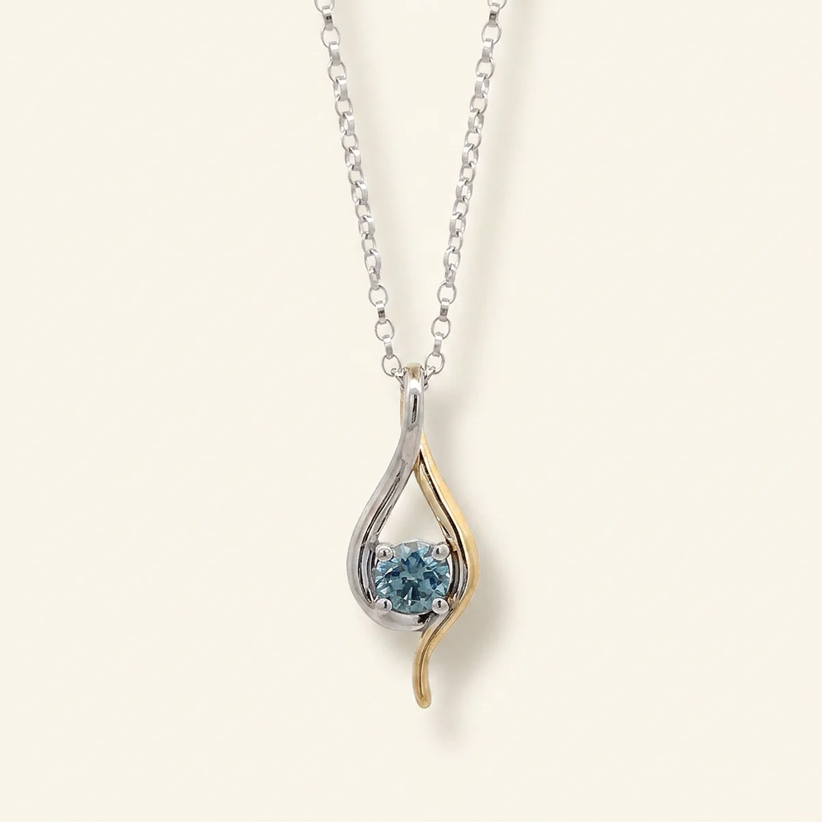 A .4ct blue round diamond on a mixed metal pendant, custom-designed by Eterneva to honor the remarkable Marie.