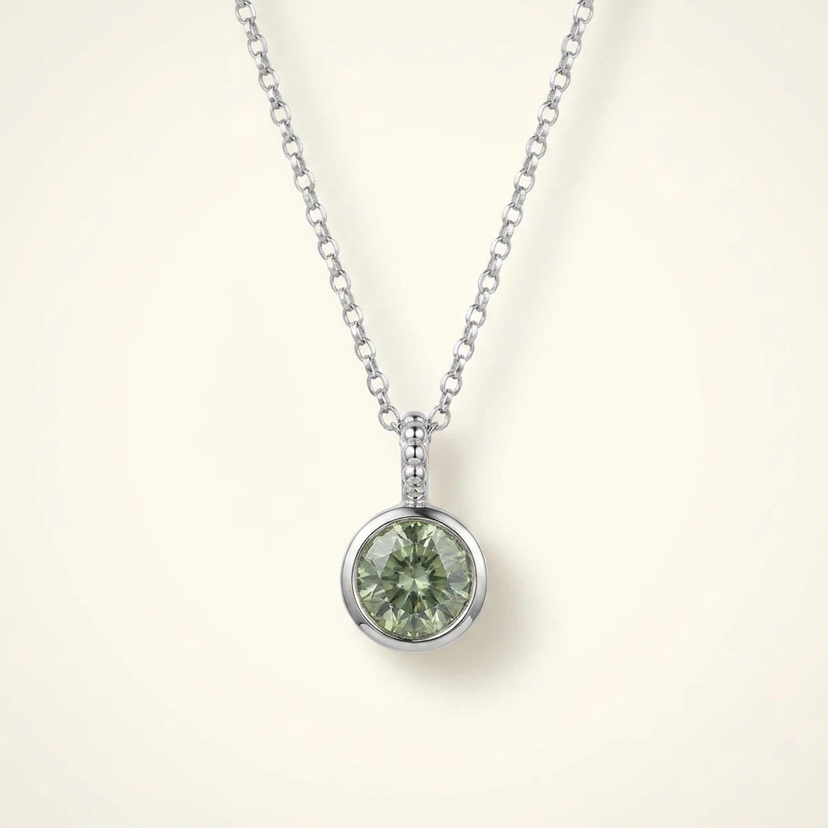 A .5ct green round diamond on a white gold necklace, custom-designed by Eterneva to honor the remarkable Erma.