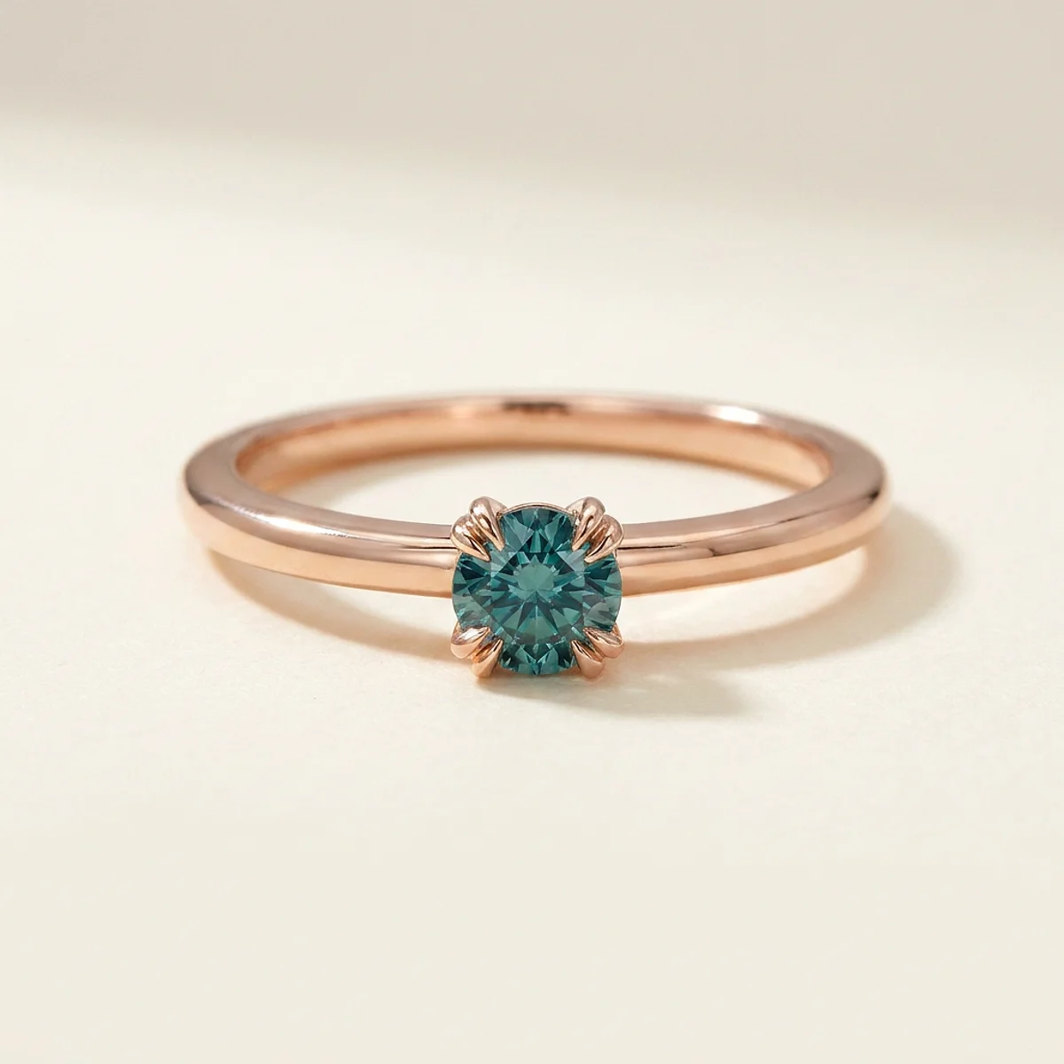 A .25ct blue round diamond on a rose gold ring, custom-designed by Eterneva to honor the remarkable River.