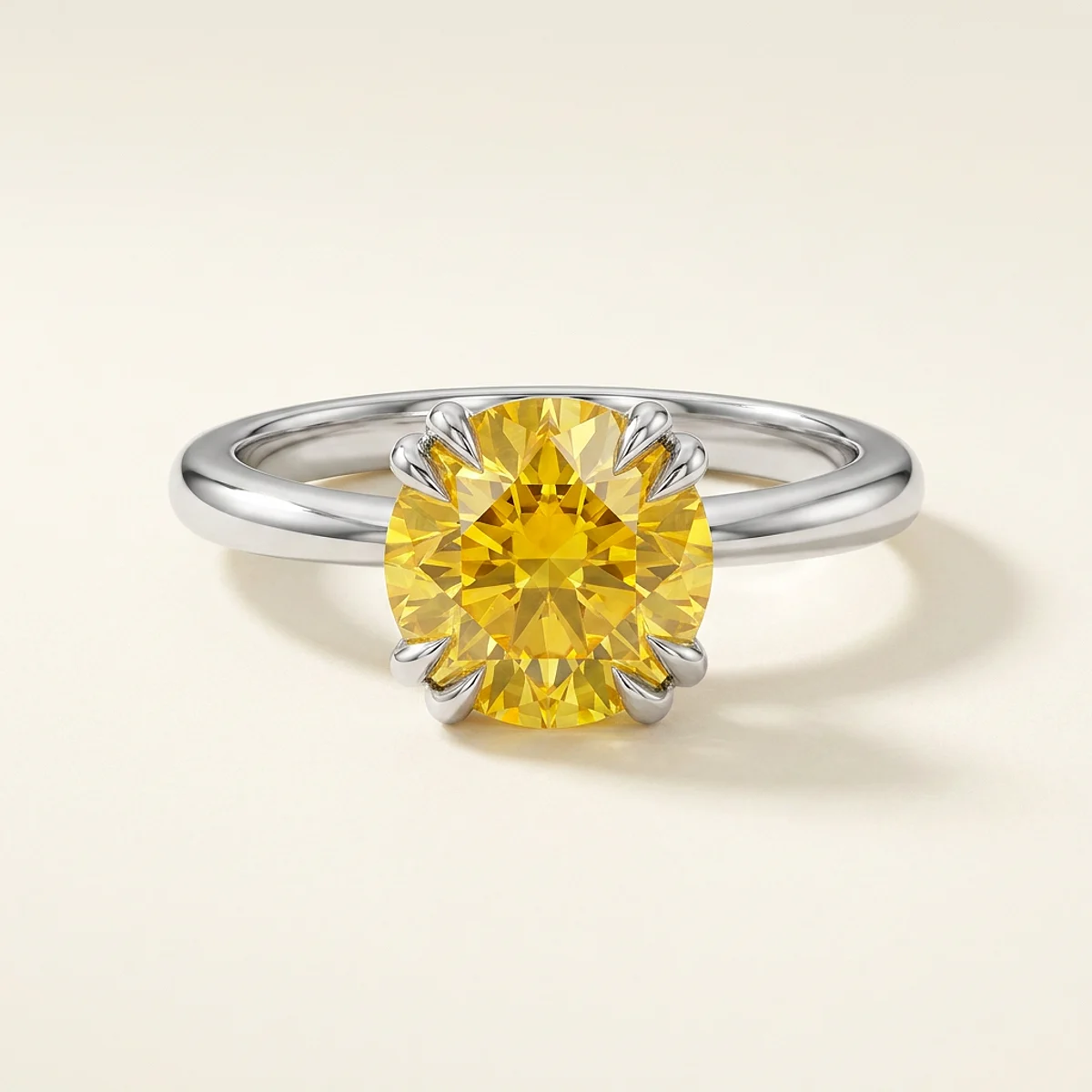 A 1.5ct yellow round diamond on a white gold ring, custom-designed by Eterneva to honor the remarkable Victoria.