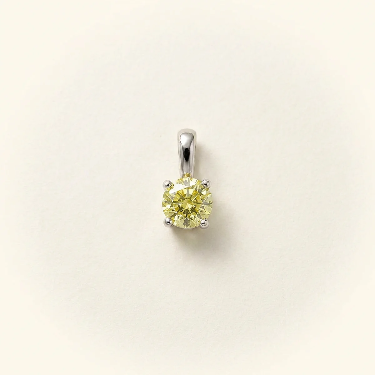 A .5ct yellow round diamond on a white gold pendant, custom-designed by Eterneva to honor the remarkable Heath.