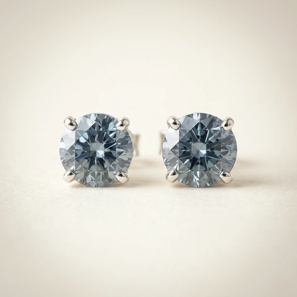A .25ct blue round diamond on white gold earrings, custom-designed by Eterneva to honor the remarkable Brian.