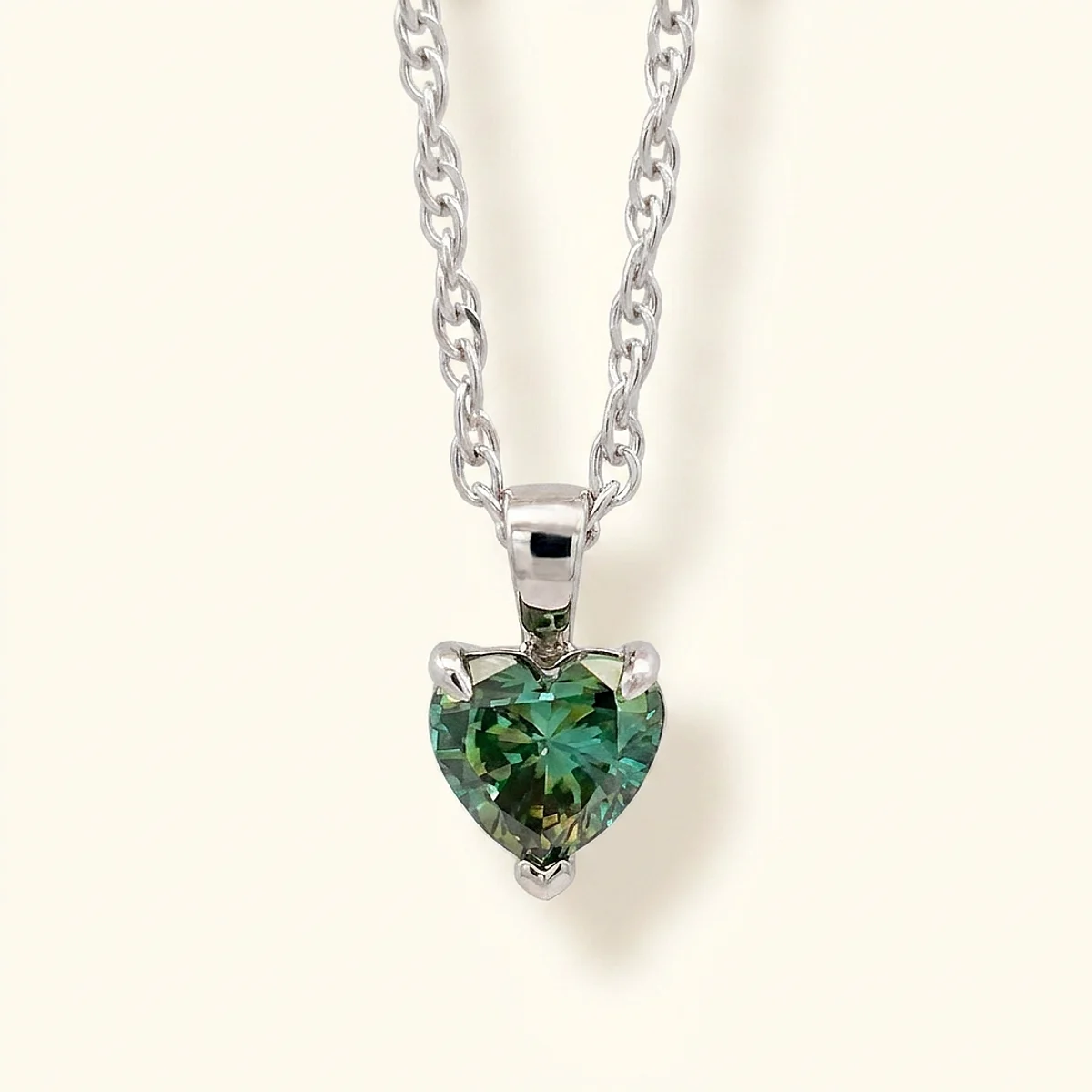 A .75ct green heart diamond on a white gold pendant, custom-designed by Eterneva to honor the remarkable Natalie.