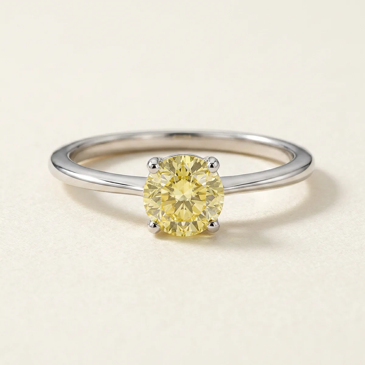 A .75ct yellow round diamond on a white gold ring, custom-designed by Eterneva to honor the remarkable Lucy.