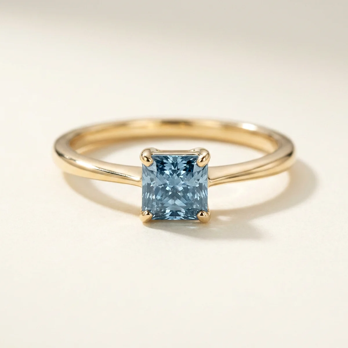 A .75ct blue square radiant diamond on a yellow gold ring, custom-designed by Eterneva to honor the remarkable Steve.