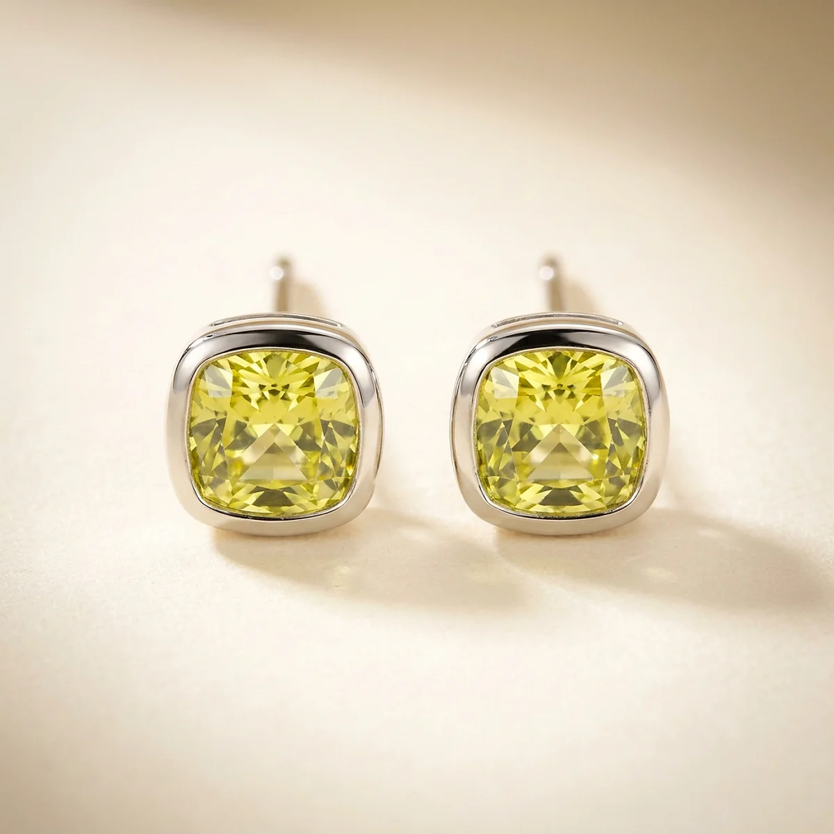 A .15ct green cushion diamond on platinum earrings, custom-designed by Eterneva to honor the remarkable Greyson.
