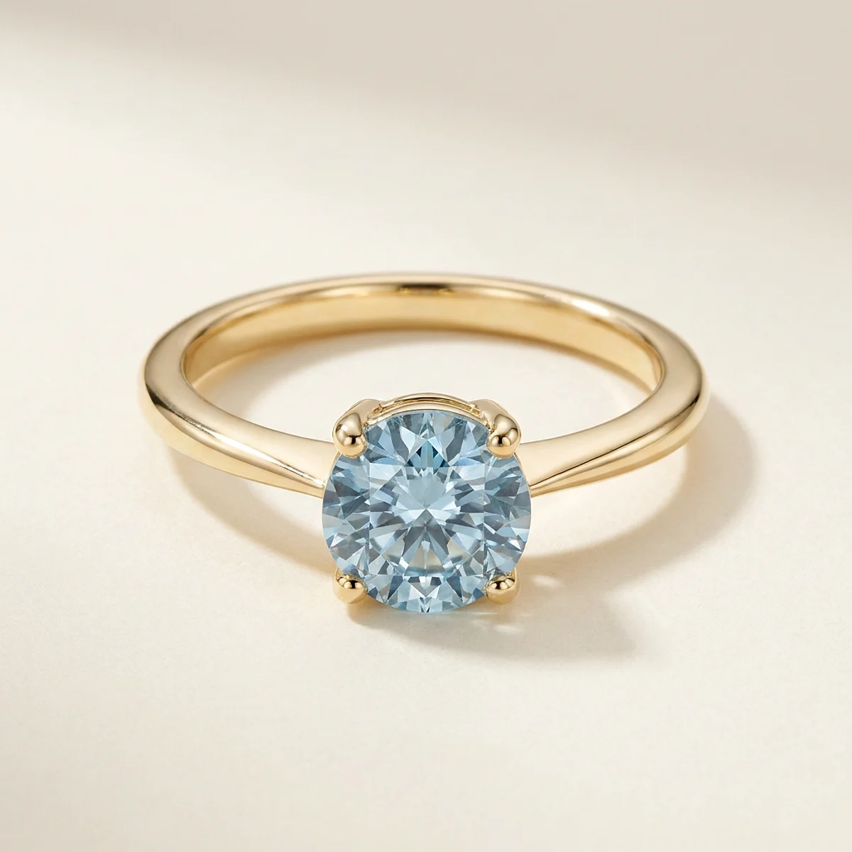 A 1ct blue round diamond on a yellow gold ring, custom-designed by Eterneva to honor the remarkable Tristan.