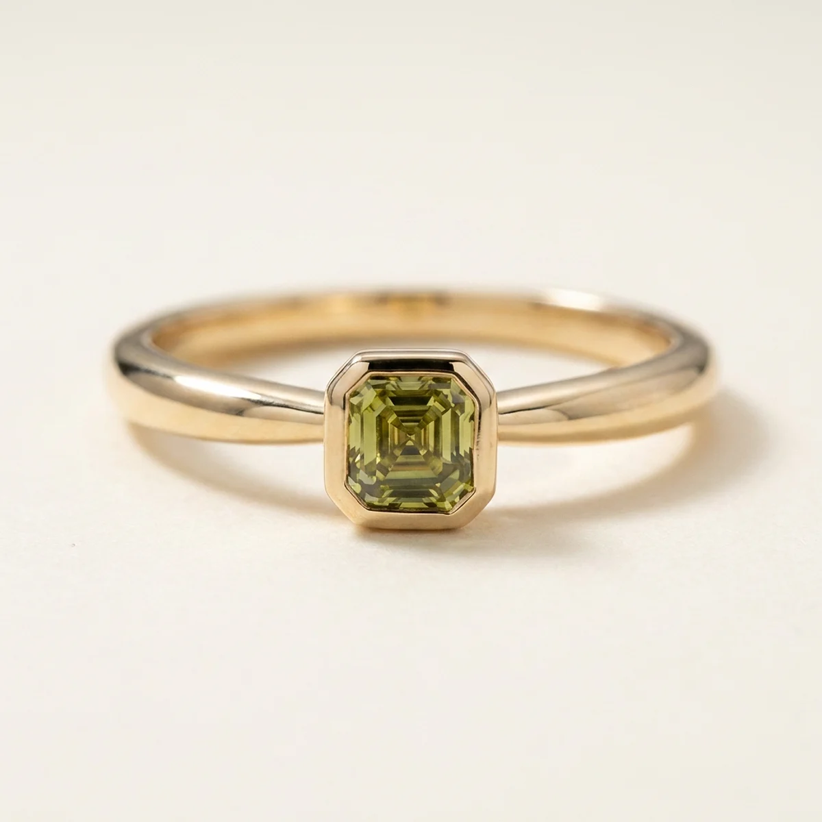 A .4ct green asscher diamond on a yellow gold ring, custom-designed by Eterneva to honor the remarkable Benjamin.