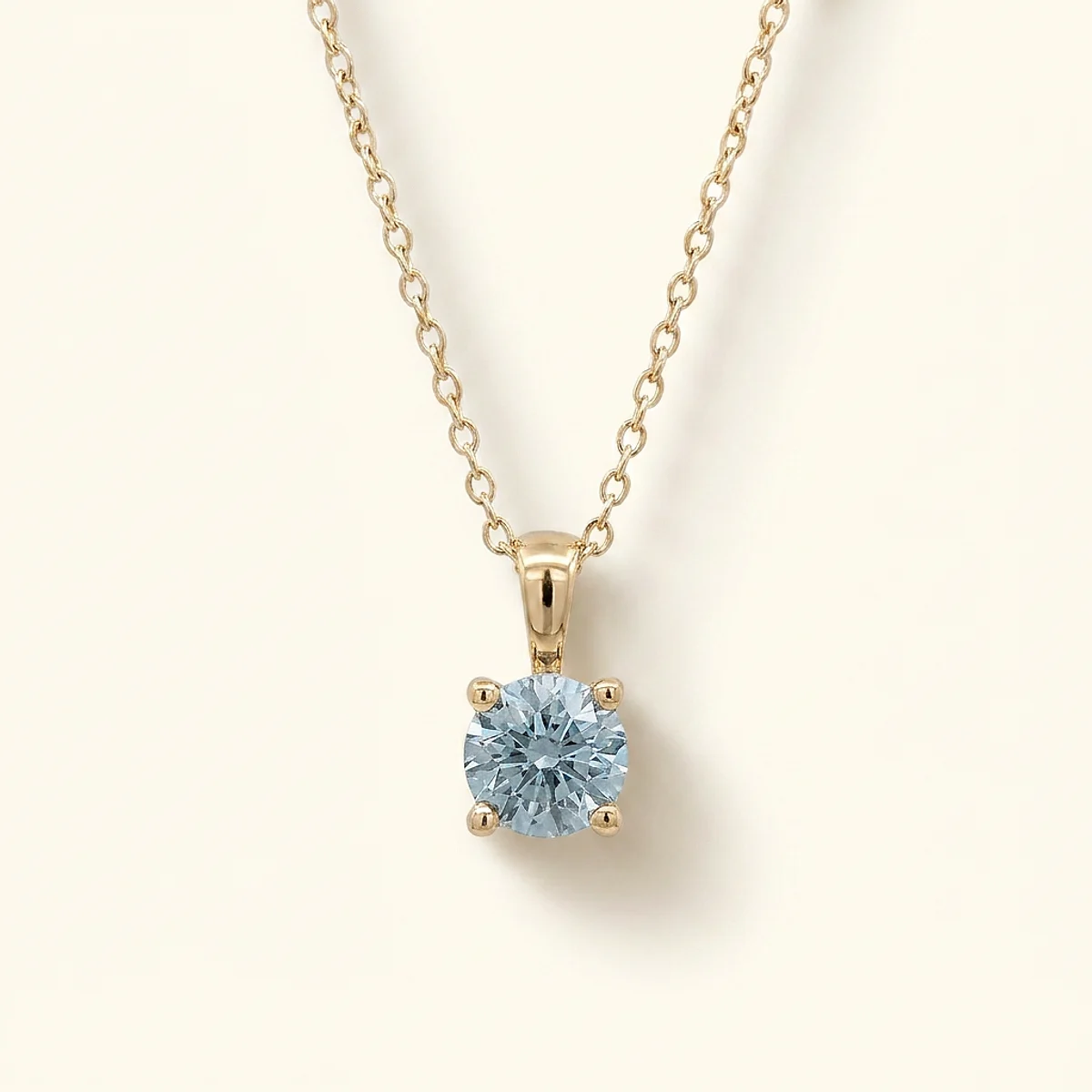 A .5ct blue round diamond on a yellow gold pendant, custom-designed by Eterneva to honor the remarkable Norbert.