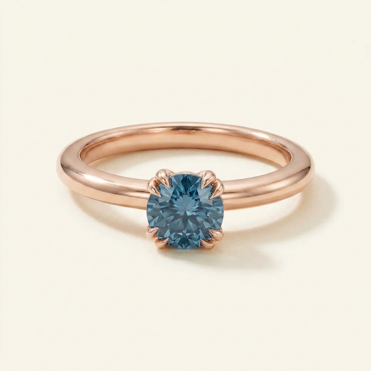 A .4ct blue round diamond on a rose gold ring, custom-designed by Eterneva to honor the remarkable Ashton.