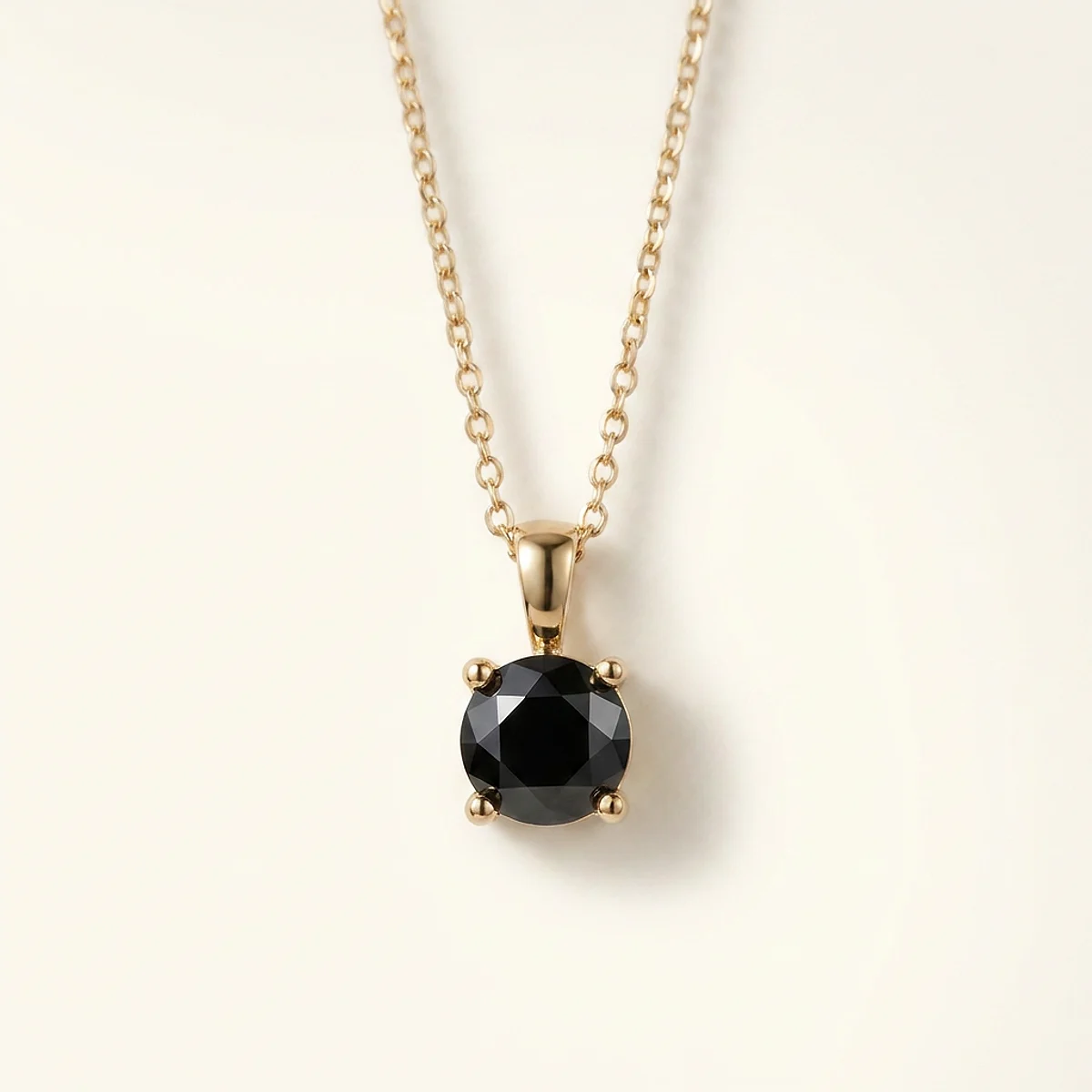 A 1ct black round diamond on a yellow gold pendant, custom-designed by Eterneva to honor the remarkable Bentley.