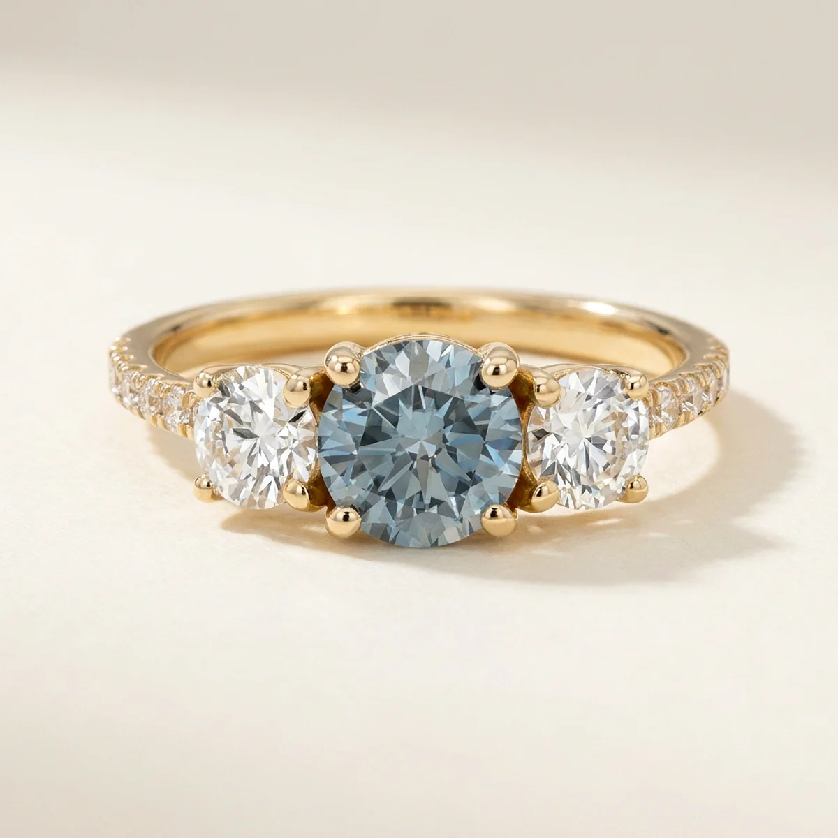 A 1ct blue round diamond on a yellow gold ring, custom-designed by Eterneva to honor the remarkable Jatin.