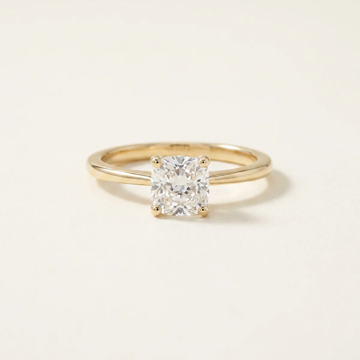 A 1ct colorless cushion diamond on a yellow gold ring, custom-designed by Eterneva to honor the remarkable Shawn.