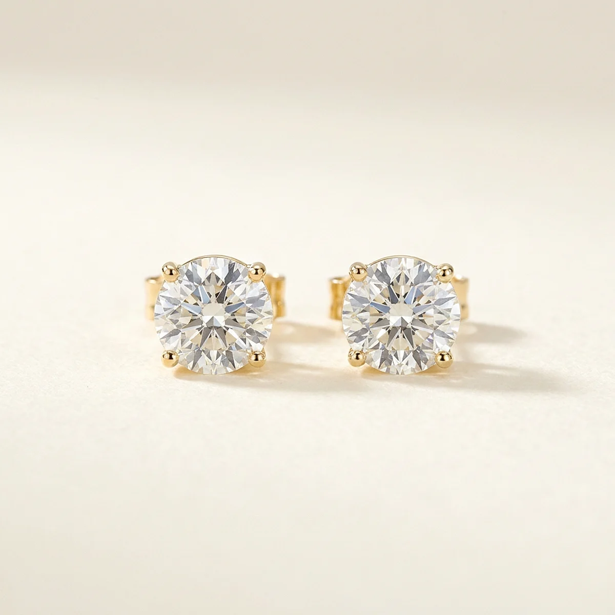 A .75ct colorless round diamond on yellow gold earrings, custom-designed by Eterneva to honor the remarkable Vickie.