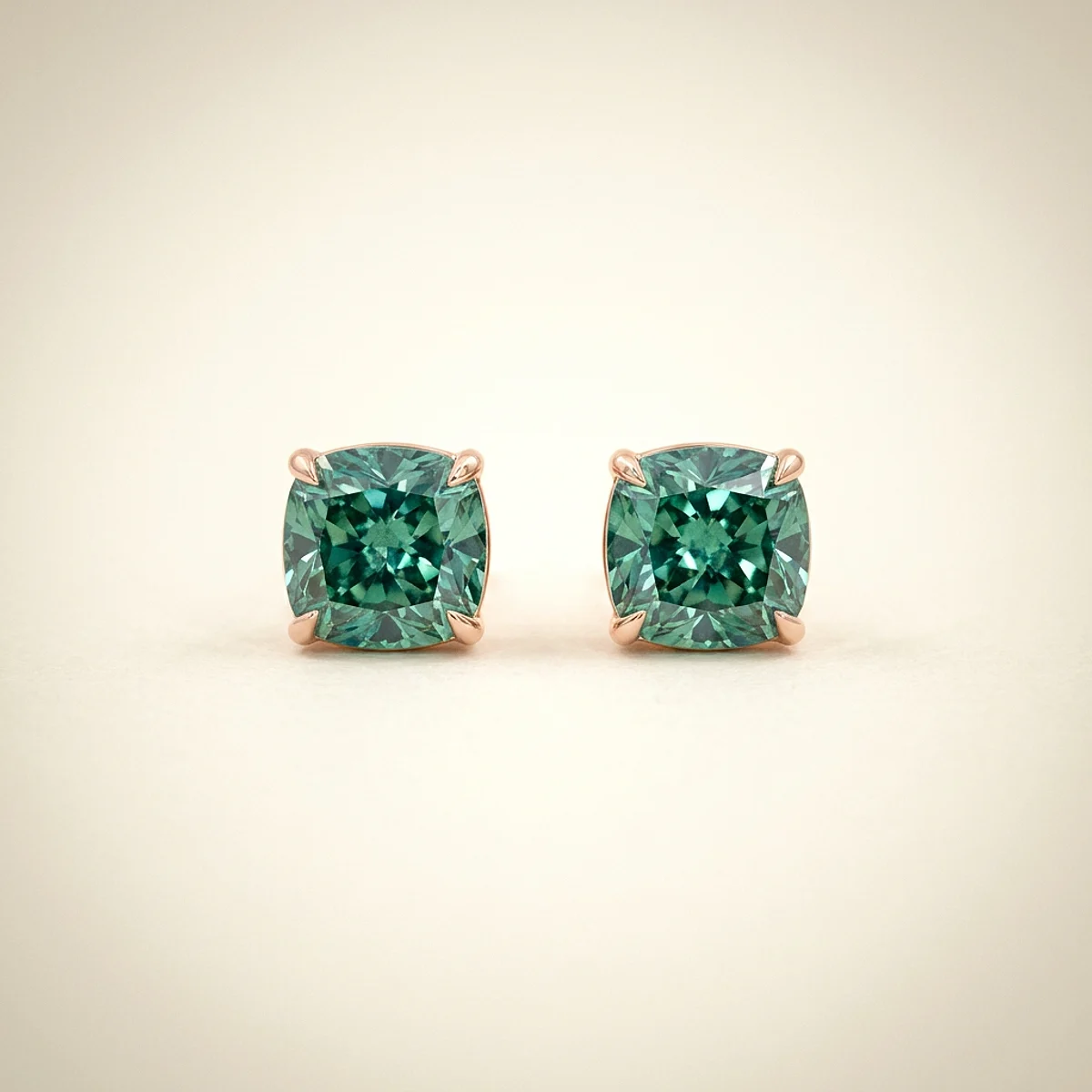 A .75ct green cushion diamond on rose gold earrings, custom-designed by Eterneva to honor the remarkable Artemis.