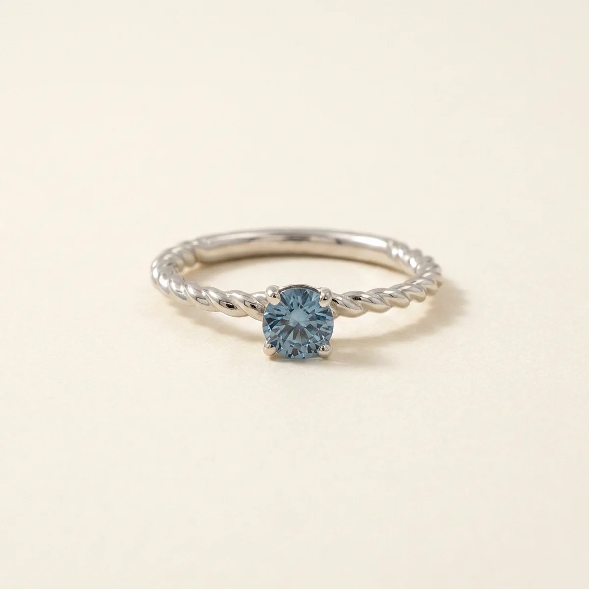 A .25ct blue round diamond on a white gold ring, custom-designed by Eterneva to honor the remarkable Julio.