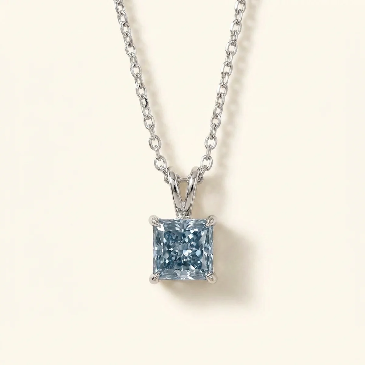 A .75ct blue rectangular radiant diamond on a platinum necklace, custom-designed by Eterneva to honor the remarkable John.