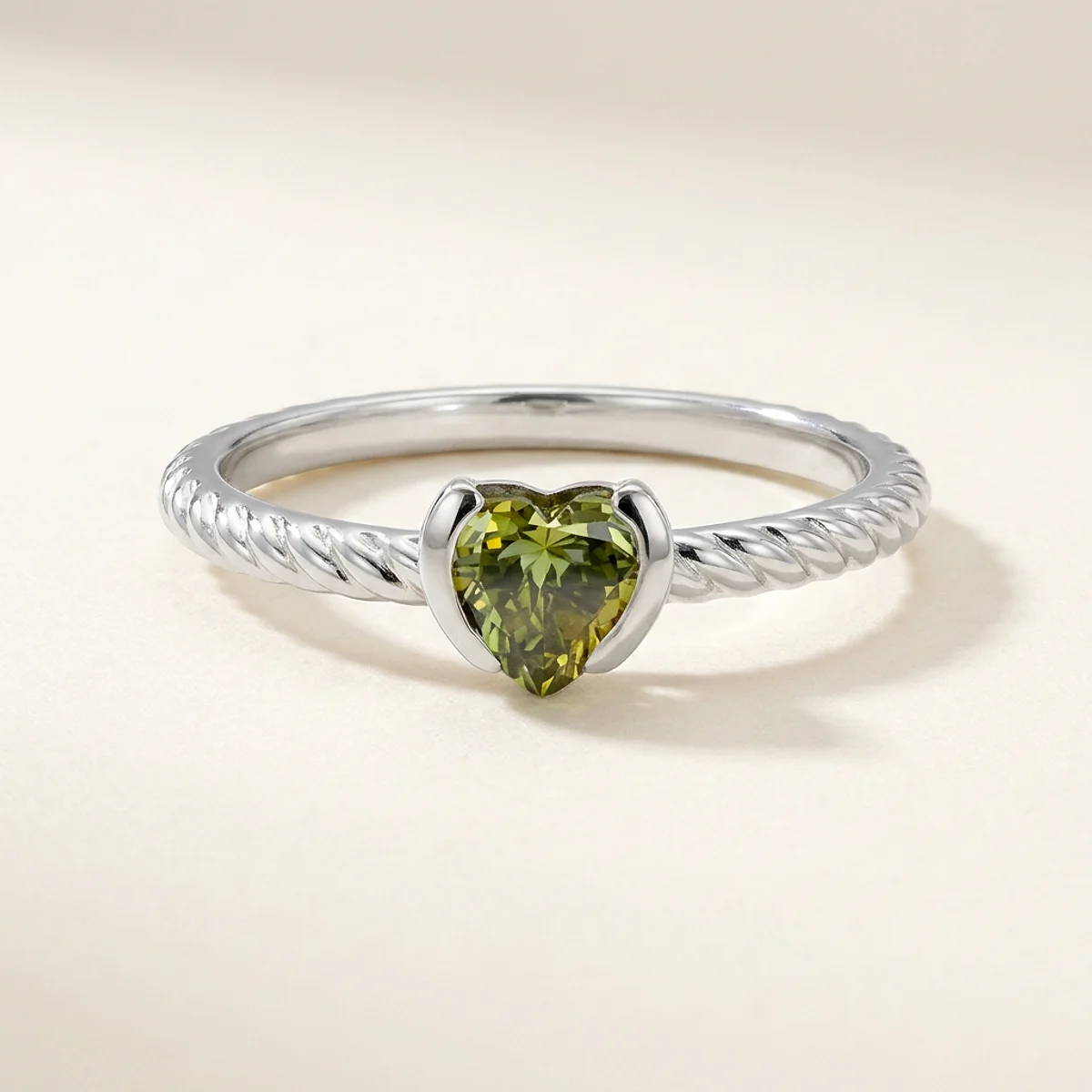 A .5ct green heart diamond on a white gold ring, custom-designed by Eterneva to honor the remarkable Nemes.