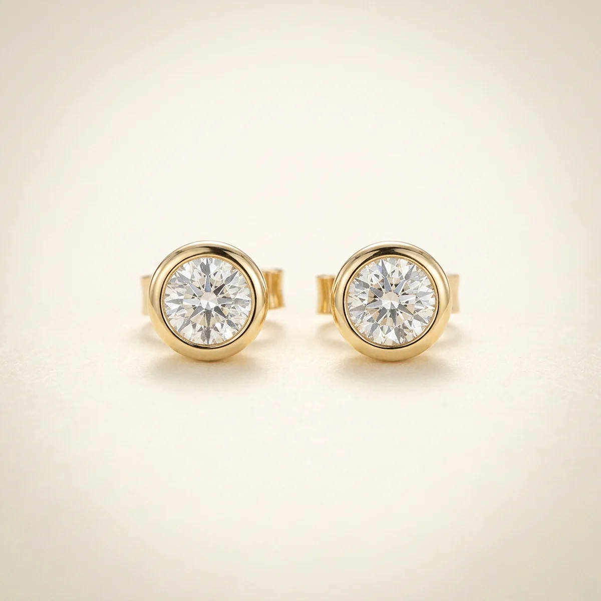 A .25ct colorless round diamond on yellow gold earrings, custom-designed by Eterneva to honor the remarkable Daisy.