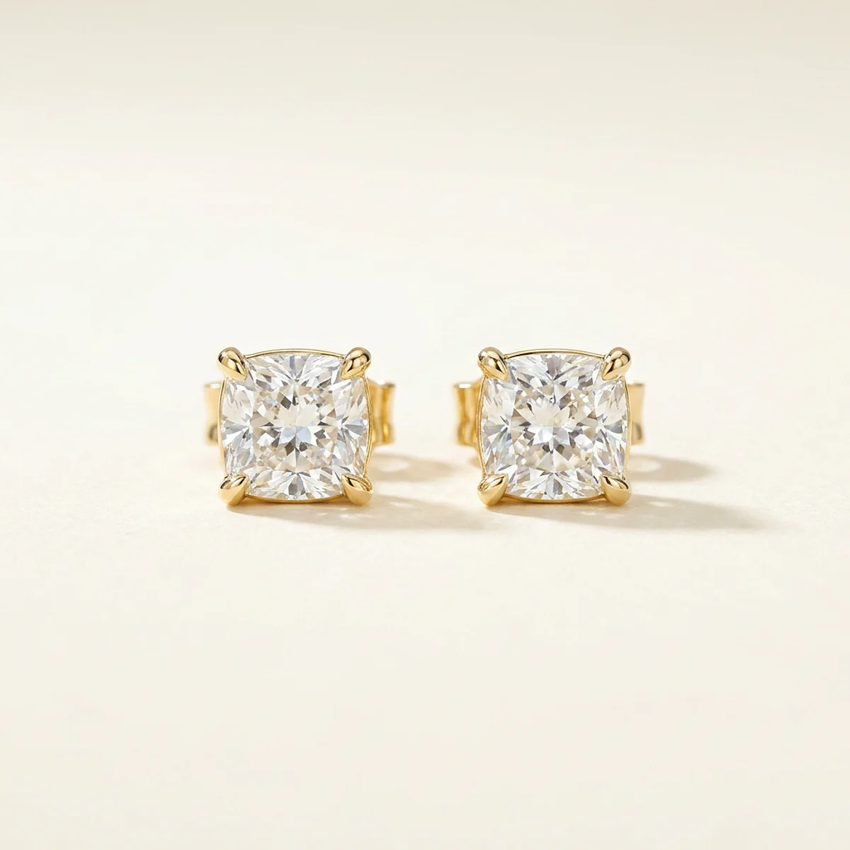 A .25ct colorless cushion diamond on yellow gold earrings, custom-designed by Eterneva to honor the remarkable Leona.