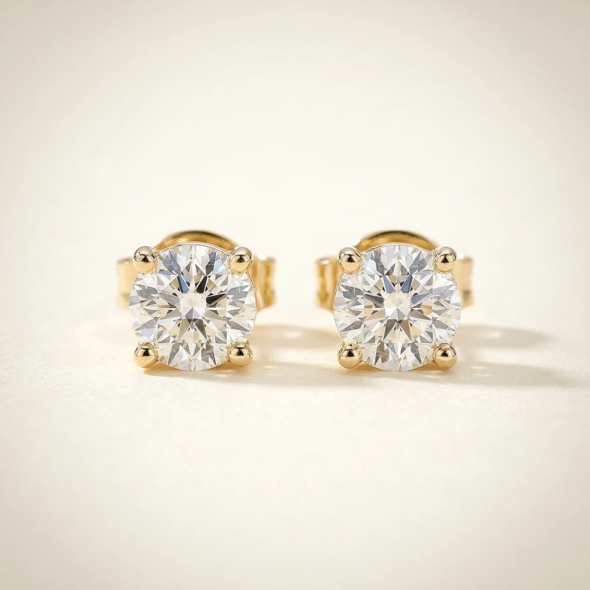 A .75ct colorless round diamond on yellow gold earrings, custom-designed by Eterneva to honor the remarkable Lolita.