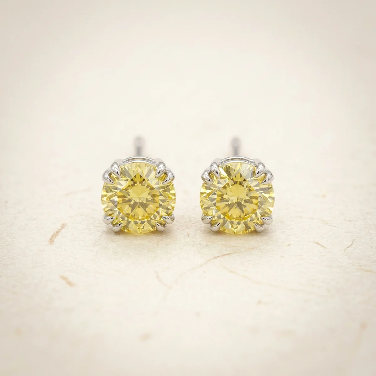A .25ct yellow round diamond on white gold earrings, custom-designed by Eterneva to honor the remarkable Massimo.