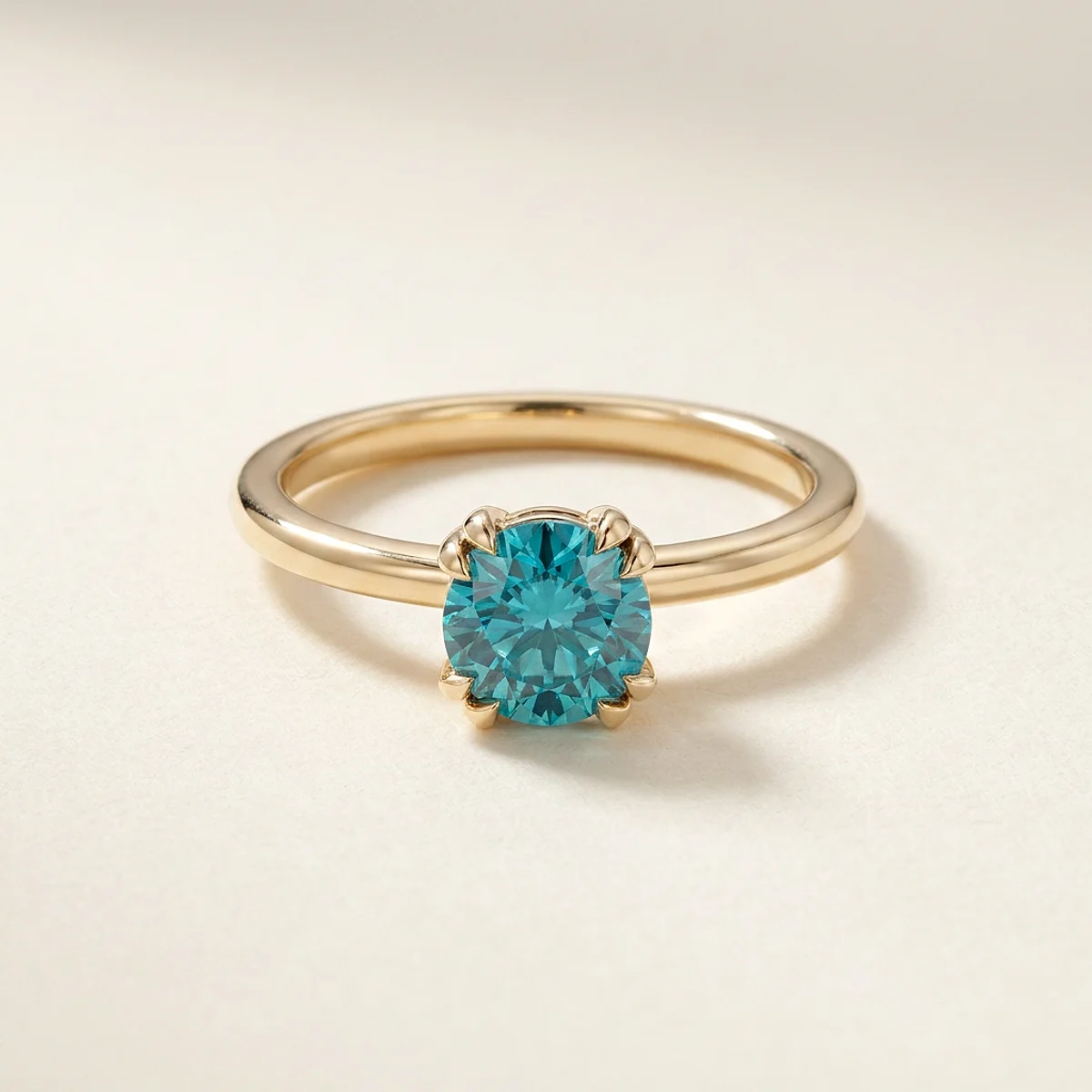 A 1ct blue round diamond on a yellow gold ring, custom-designed by Eterneva to honor the remarkable James.