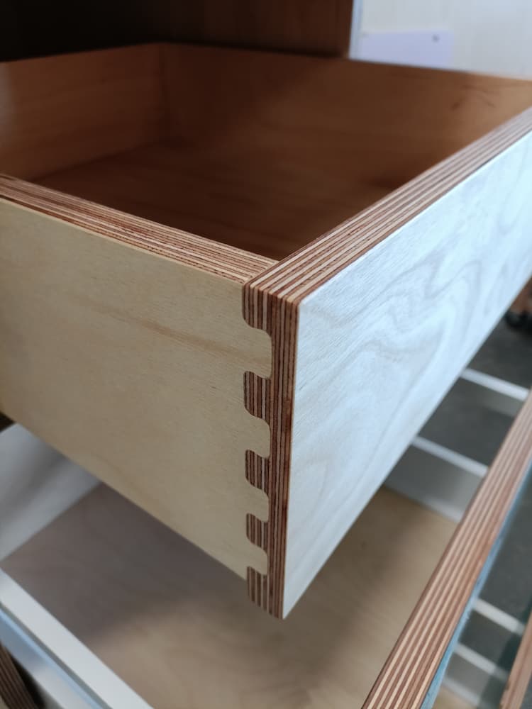 Birch plywood drawer with exposed layered corner joints.