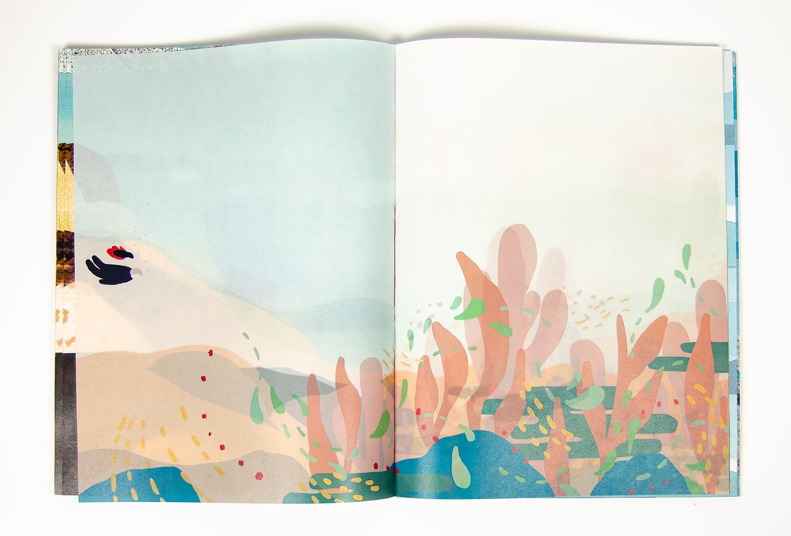 open book spread featuring an illustration of two characters swimming amongst underwater elements printed on glassine paper