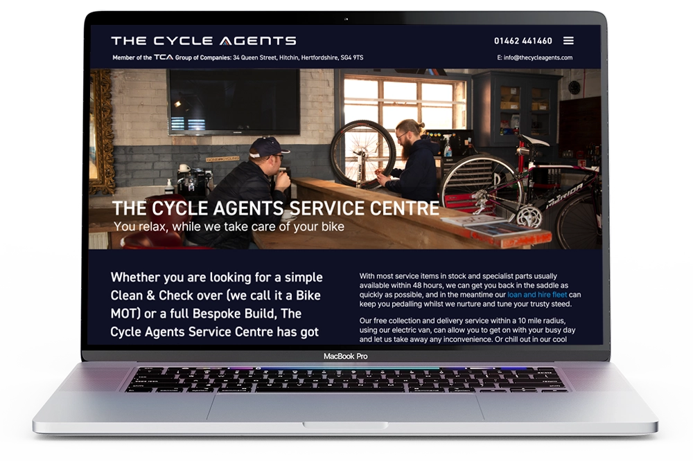 TCA Website shown on MacBook Pro