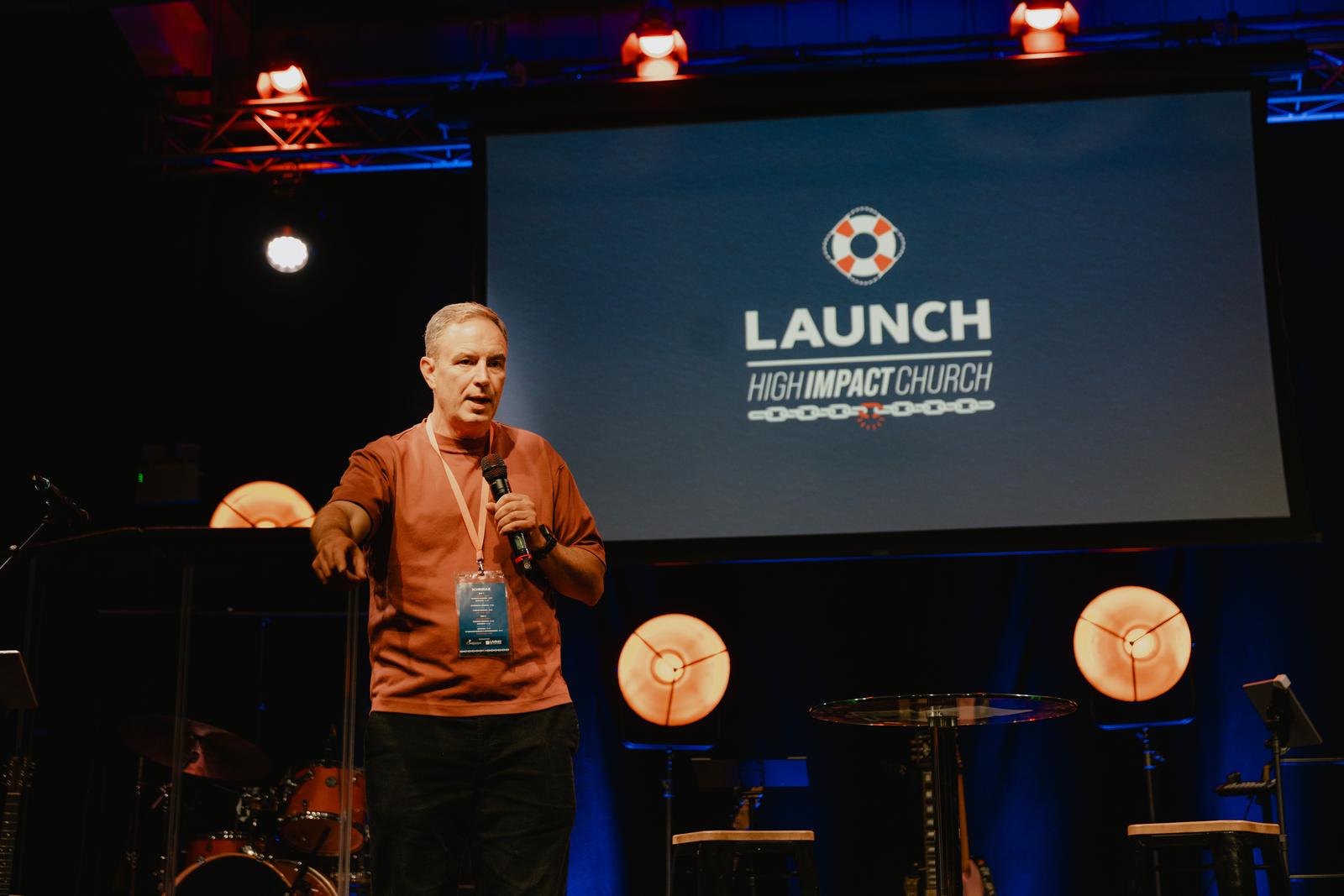 A speaker on the LAUNCH 2025 main stage