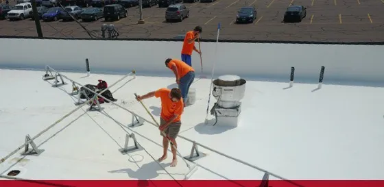 titan team installing roof coating