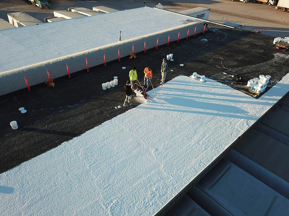 Denver, CO trucking center roof during spray foam work.