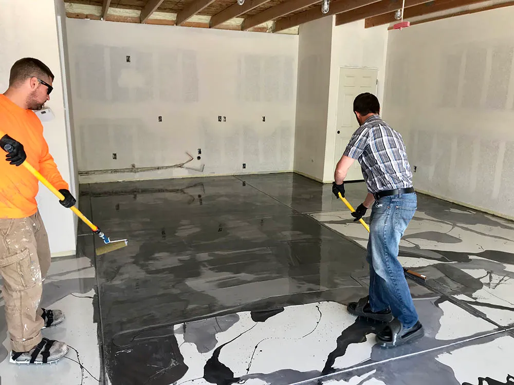 Metallic epoxy garage floor coating installation process.