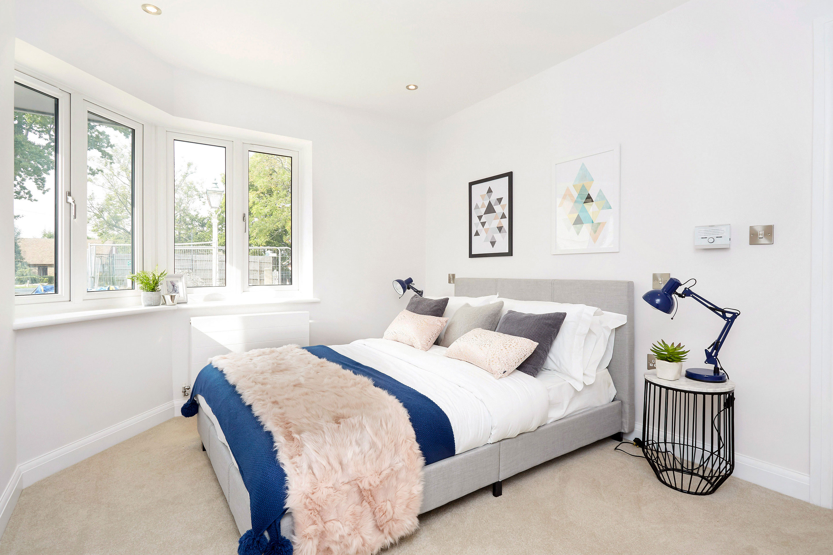 Bright double bedroom with circular bay windows