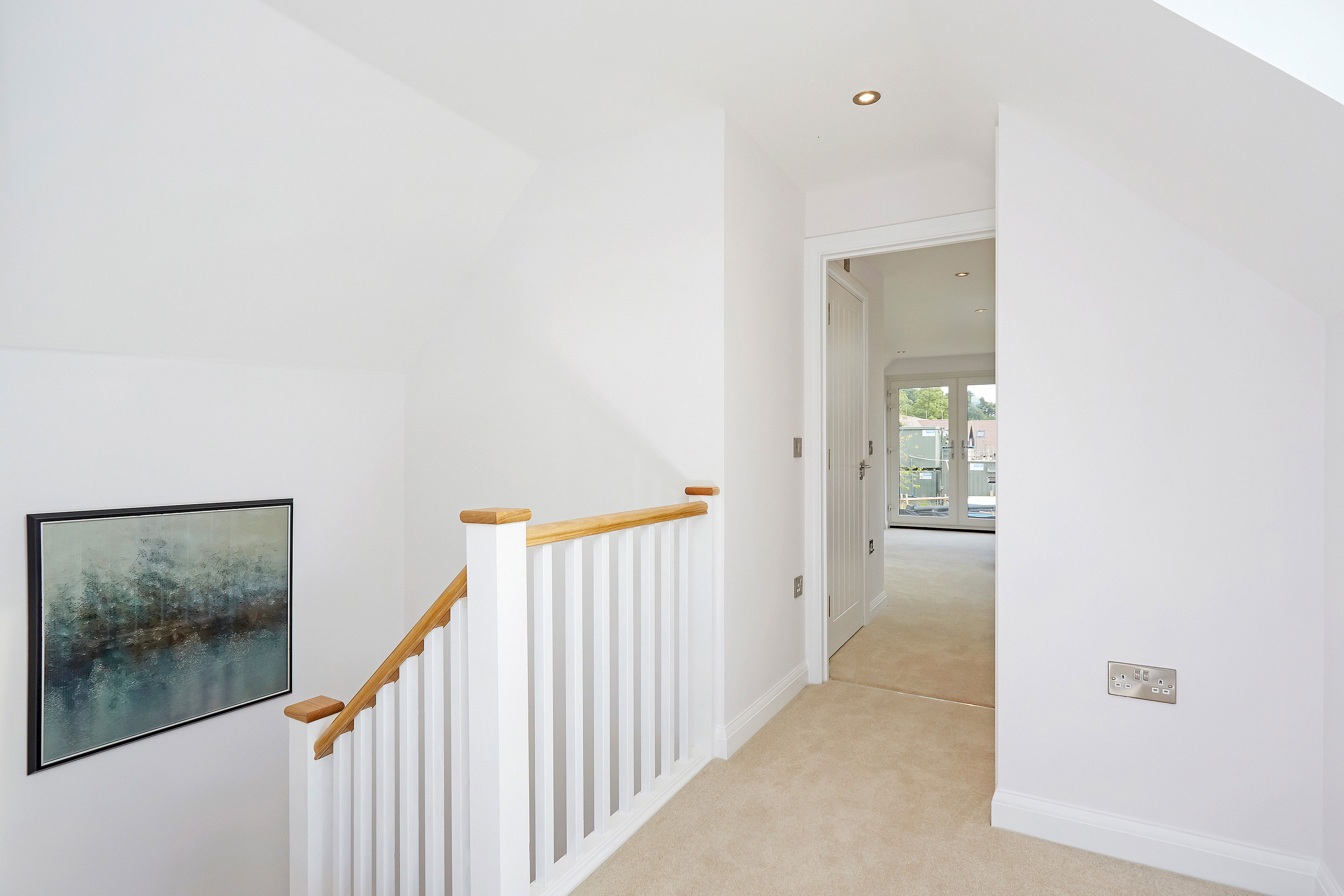 Bright landing area with art on the wall