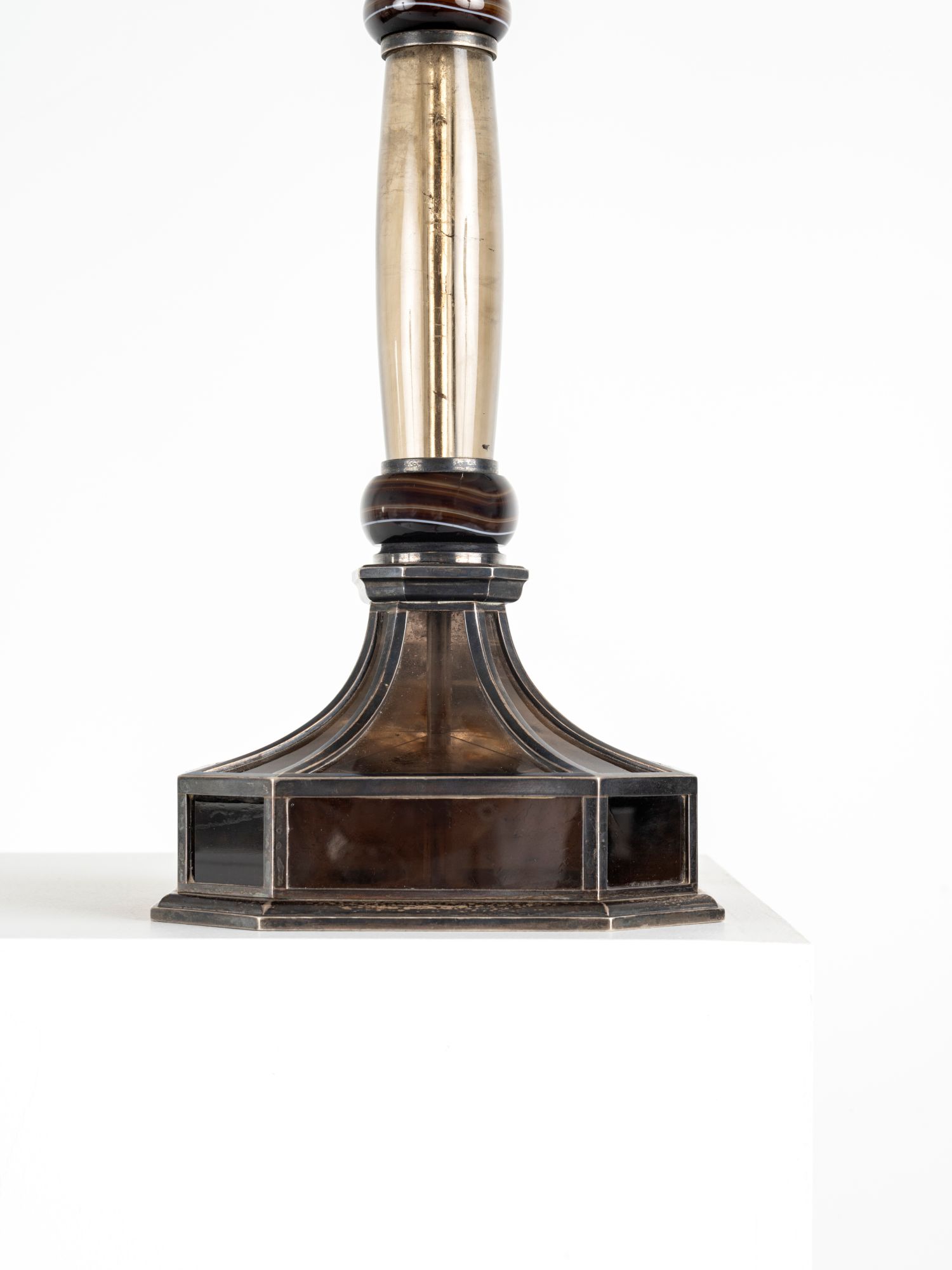 Rock crystal Agate and silver plated bronze lamp.
Jacques Doucet, renowned fashion designer and visionary, is undoubtedly the greatest patron of Art Deco. Long displayed on his Pierre Legrain desk in his Parisian apartment, this one of a kind piece was his personal lamp. This lamp was a gift from Madame Doucet to Monsieur and Madame Thion, the grandparents of the last owners. Madame Doucet was one of the witnesses at the wedding of Madame Yvonne Dambreville, née Thion, mother of the current owners. Provenance: Jacques Doucet