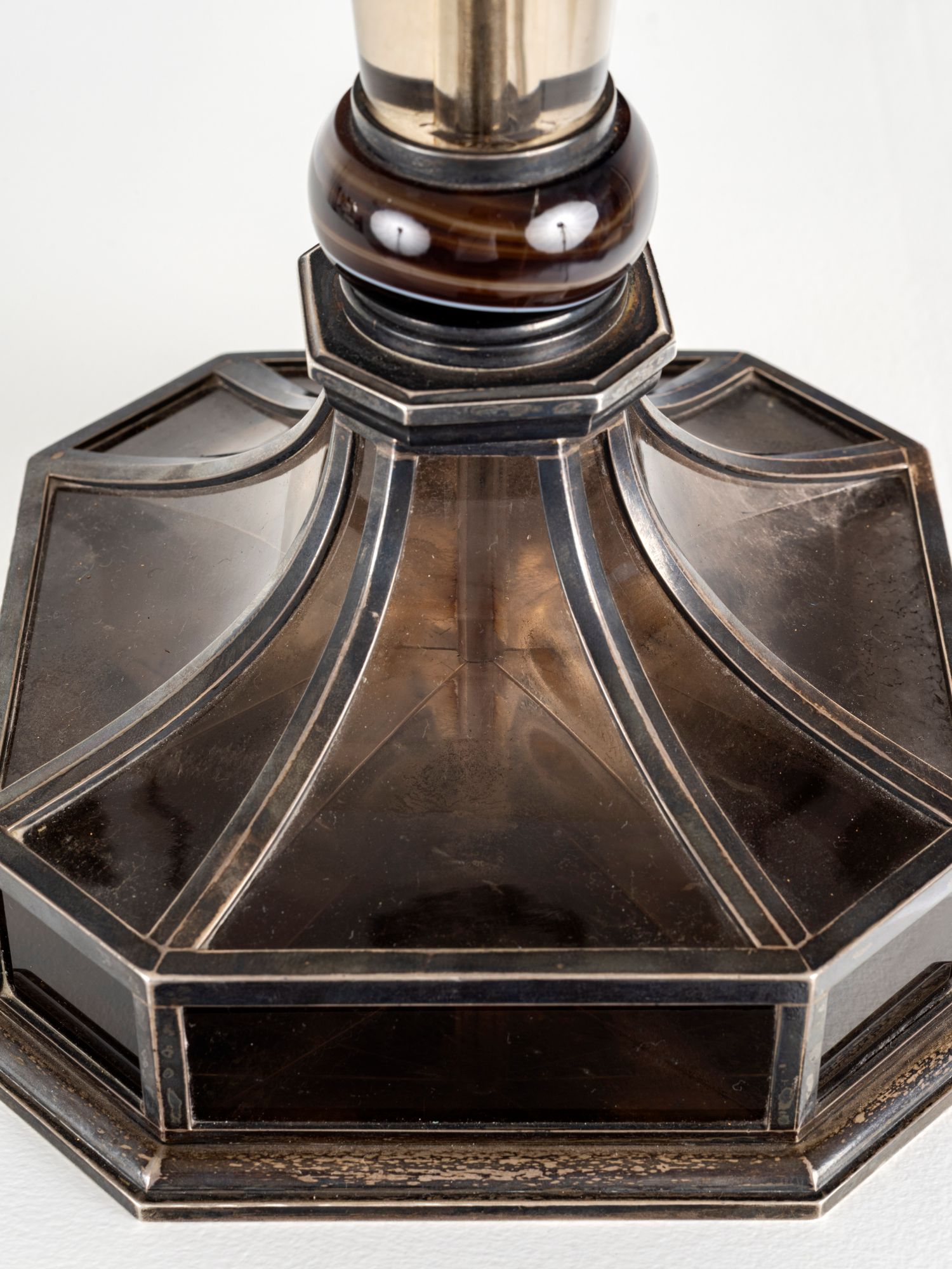 Rock crystal Agate and silver plated bronze lamp.
Jacques Doucet, renowned fashion designer and visionary, is undoubtedly the greatest patron of Art Deco. Long displayed on his Pierre Legrain desk in his Parisian apartment, this one of a kind piece was his personal lamp. This lamp was a gift from Madame Doucet to Monsieur and Madame Thion, the grandparents of the last owners. Madame Doucet was one of the witnesses at the wedding of Madame Yvonne Dambreville, née Thion, mother of the current owners. Provenance: Jacques Doucet