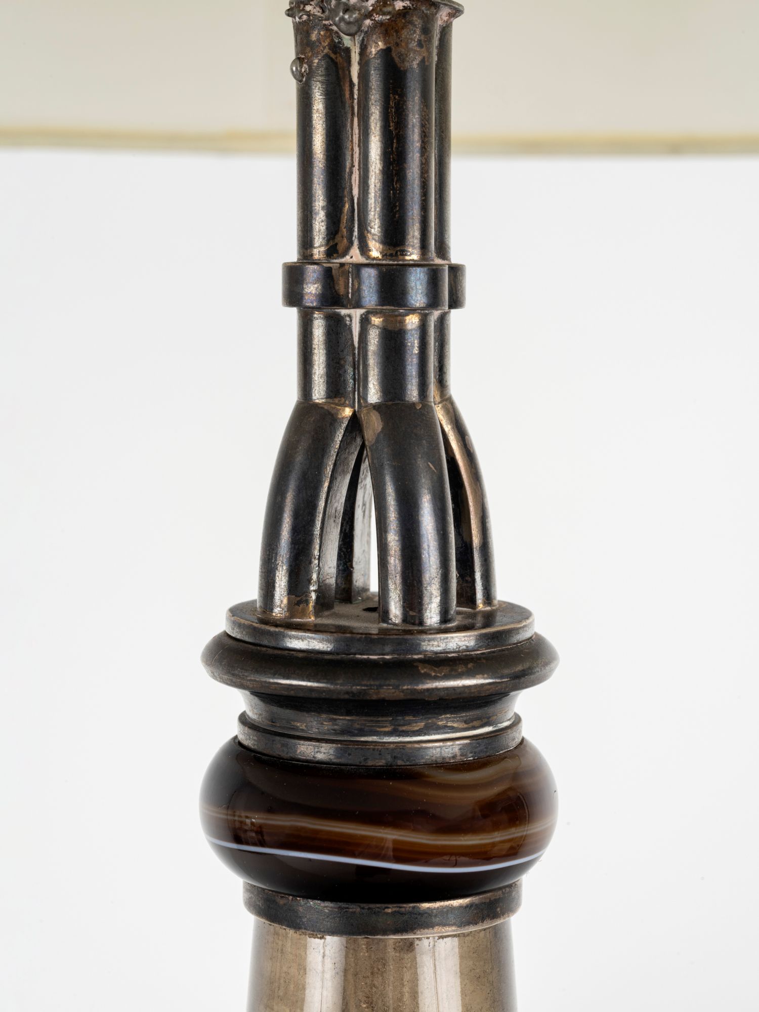 Rock crystal Agate and silver plated bronze lamp.
Jacques Doucet, renowned fashion designer and visionary, is undoubtedly the greatest patron of Art Deco. Long displayed on his Pierre Legrain desk in his Parisian apartment, this one of a kind piece was his personal lamp. This lamp was a gift from Madame Doucet to Monsieur and Madame Thion, the grandparents of the last owners. Madame Doucet was one of the witnesses at the wedding of Madame Yvonne Dambreville, née Thion, mother of the current owners. Provenance: Jacques Doucet